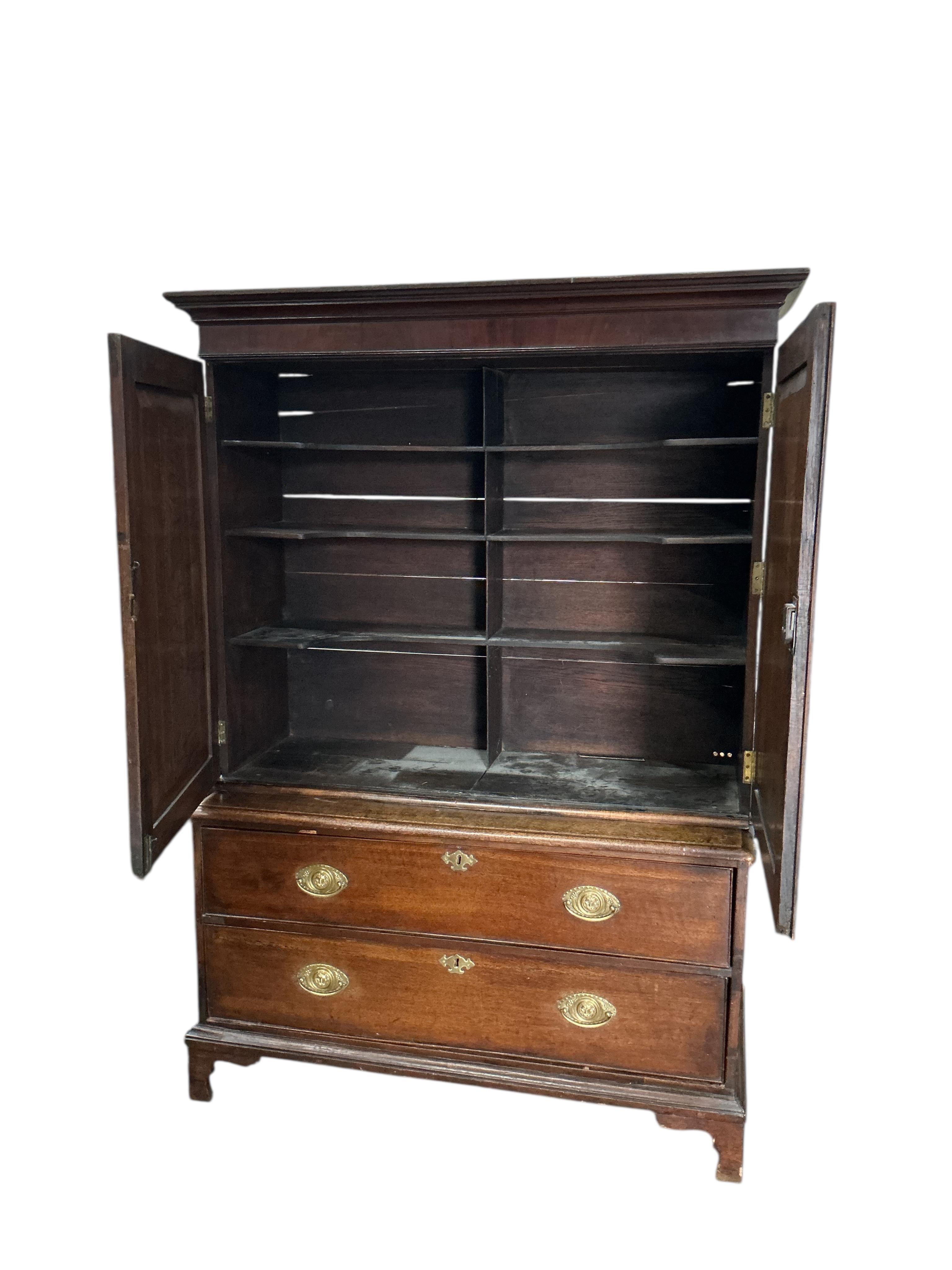 A George III oak mahogany cabinet on chest, adapted, width 115cm, depth 53cm, height 171cm